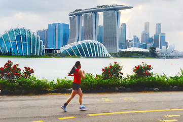 Image showing Woman jogging in Singapore bay