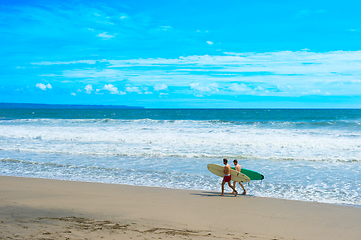 Image showing Two man surfing beach