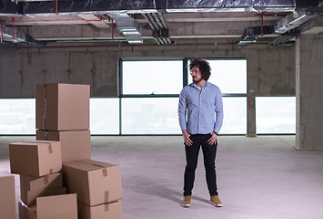 Image showing portrait of young businessman on construction site