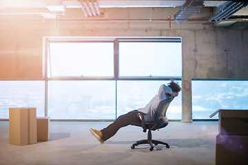 Image showing young business man taking a break on construction site