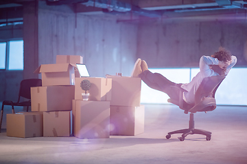 Image showing young business man taking a break on construction site