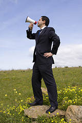 Image showing Businessman speaking with a megaphone