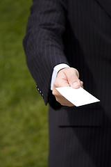 Image showing Businessman showing a blank card