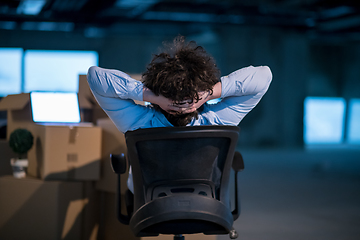 Image showing young business man taking a break on construction site