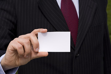 Image showing Businessman showing a blank card
