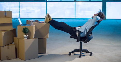 Image showing young business man taking a break on construction site