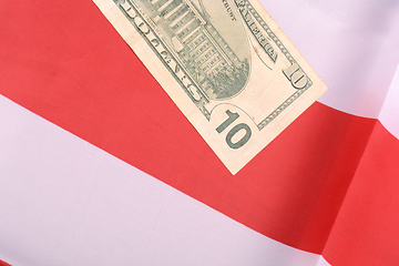 Image showing ten dollar bill in front of the American flag