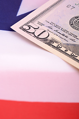 Image showing fifty dollar bill in front of the American flag