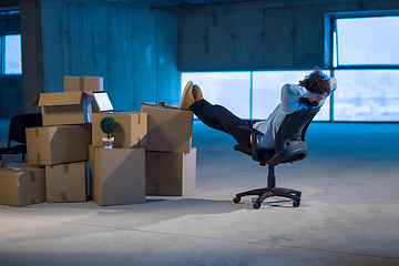 Image showing young business man taking a break on construction site