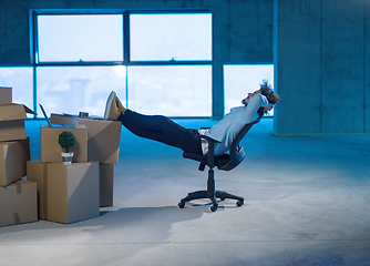 Image showing young business man taking a break on construction site