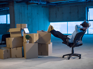 Image showing young business man taking a break on construction site