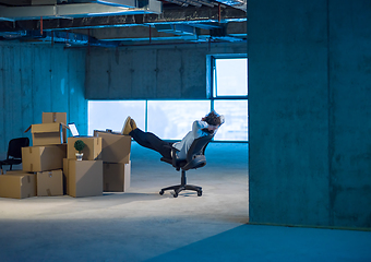 Image showing young business man taking a break on construction site