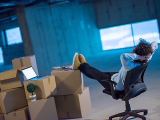 Image showing young business man taking a break on construction site