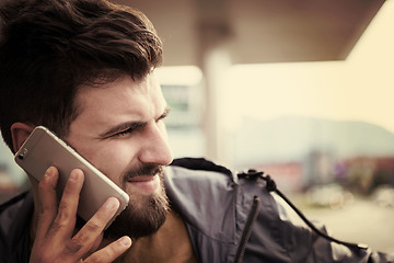 Image showing handsome young casual business man with beard using cell phone