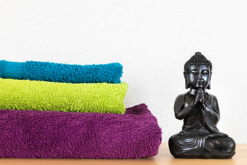 Image showing Buddha and towels background