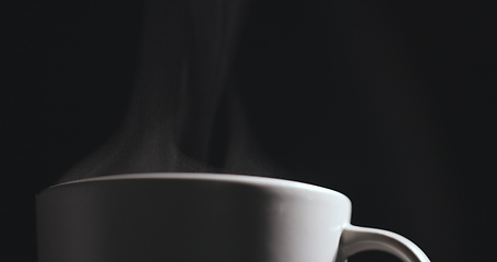 Image showing Vapor rising from hot mug closeup footage