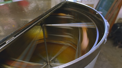 Image showing honey extractor at work in the beefarm