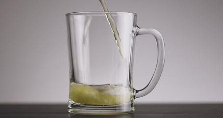 Image showing Pouring beer into big mug until its full 120fps footage timelapse