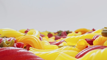 Image showing Whole grain colorful pasta in camera motion