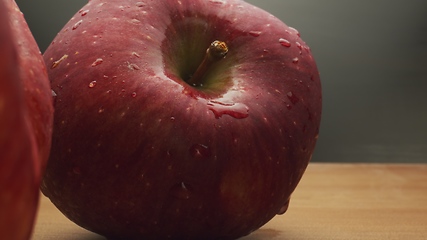 Image showing Macro footage in motion of some apples on the table