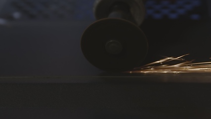 Image showing Steel cutter with sparks while cutting steel bar