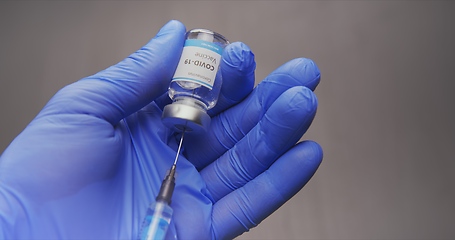 Image showing Vaccine in human hands closeup footage