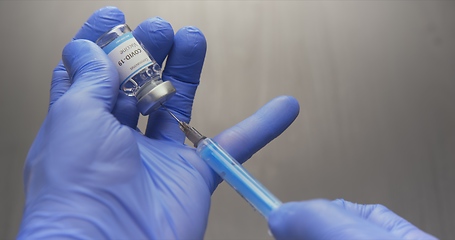 Image showing Vaccine in human hands closeup footage