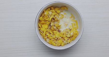 Image showing Eating bowl of cereals for breakfast