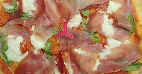 Image showing Delicious pizza surface with chease and meat rotating