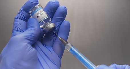 Image showing Vaccine in human hands closeup footage