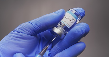 Image showing Vaccine in human hands closeup footage