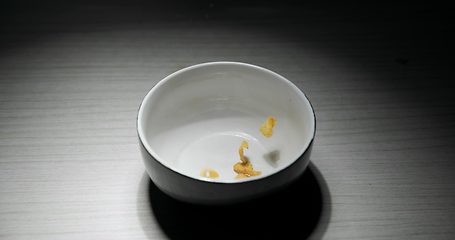 Image showing Pouring cereal into bowl closeup