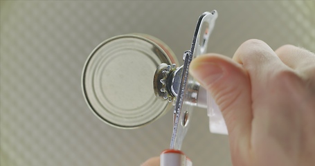 Image showing Opening up a can in 120 fps slow motion top view