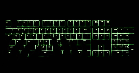 Image showing Hands typing in the dark on illuminated keyboard