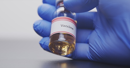 Image showing Vaccine in human hands closeup footage