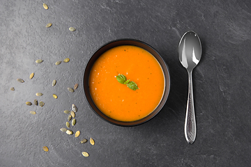 Image showing vegetable pumpkin cream soup in bowl with spoon