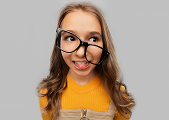 Image showing smiling teenage student girl in glasses