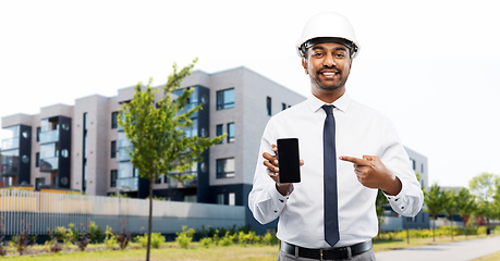 Image showing architect showing smartphone on city street