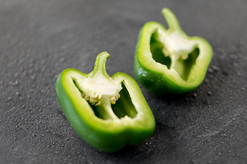 Image showing cut green pepper on slate stone background