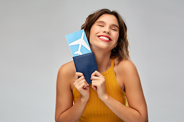 Image showing happy young woman with air ticket and passport