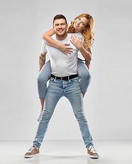 Image showing happy couple in white t-shirts having fun