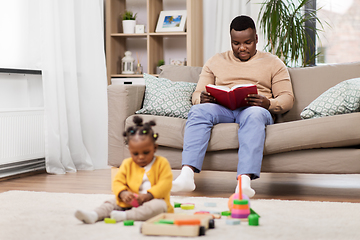 Image showing happy father with tablet pc and baby at home