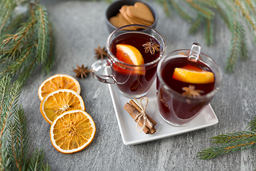 Image showing mulled wine, orange slices, gingerbread and spices