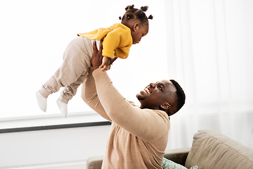 Image showing happy african american father with baby at home