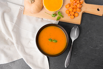 Image showing vegetable pumpkin cream soup in bowl with spoon