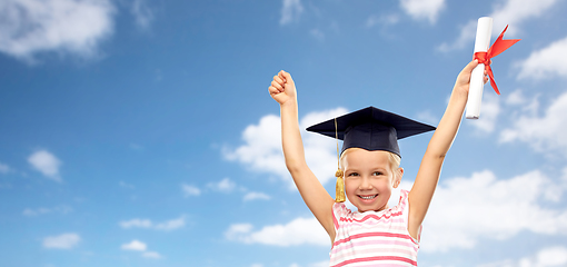 Image showing happy little girl in mortarboard with diploma