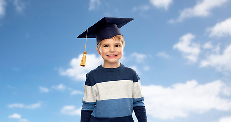 Image showing little boy in bachelor hat or mortarboard over sky