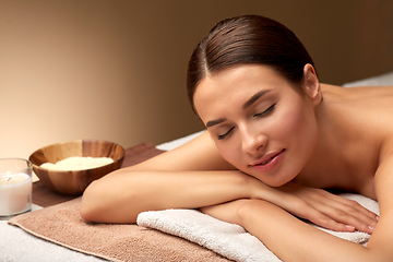 Image showing young woman lying at spa or massage parlor