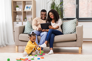 Image showing family with tablet pc and toy blocks at home