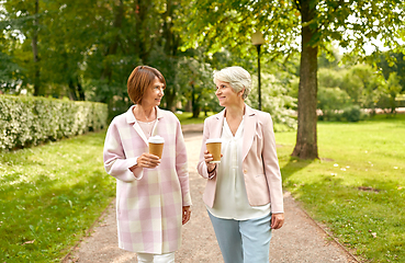 Image showing senior women or friends drinking coffee at park